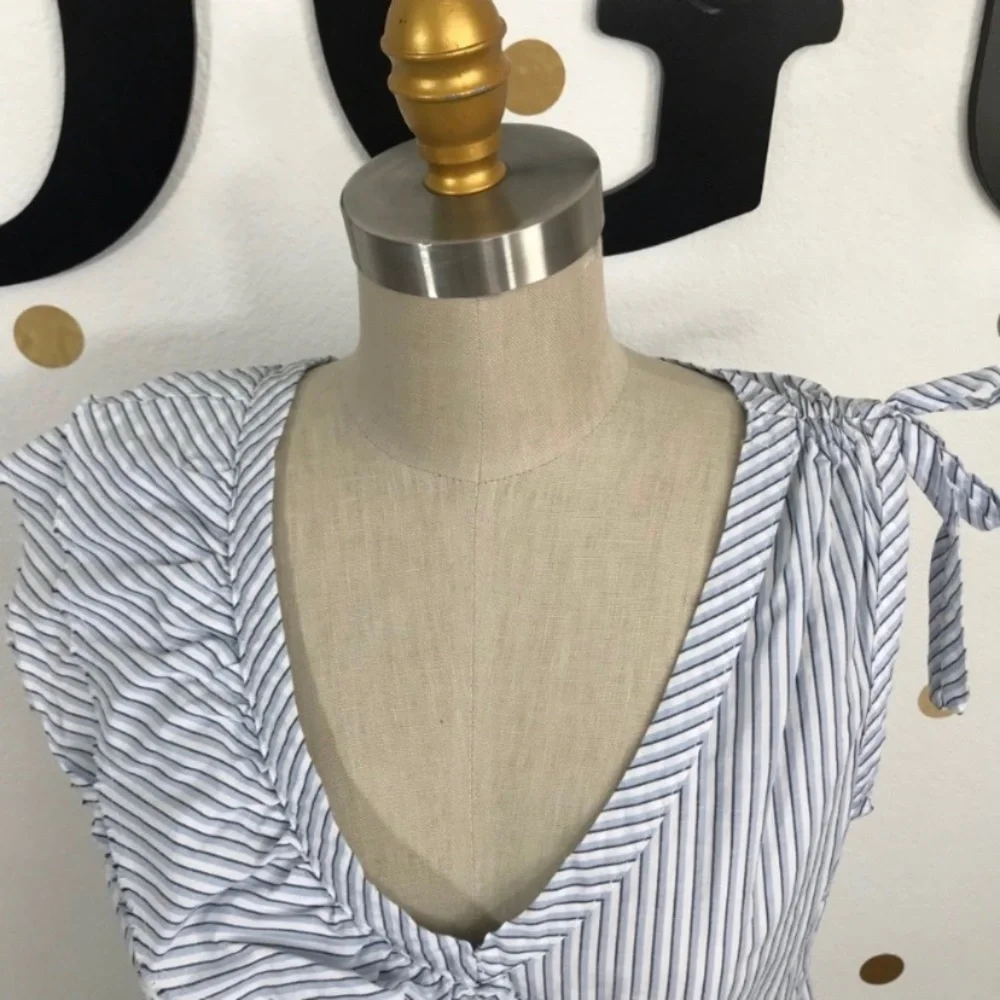Left of Center M top size M